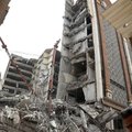 Iranians gather at the site where a ten-storey building collapsed in the southwestern city of Abadan on May 23, 2022. At least four people died and dozens were trapped under the rubble when an unfinished building collapsed in southwestern Iran, officials