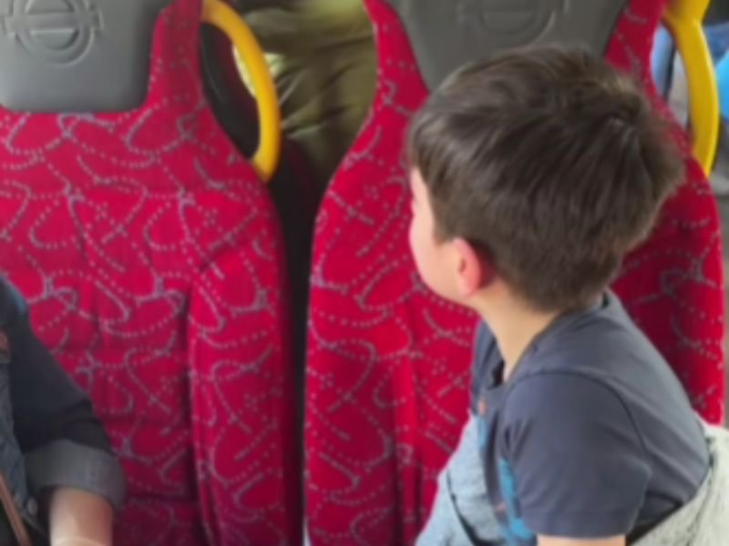 Boy being scolded in bus