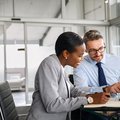 Business partners working on digital tablet