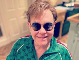 Elton John wearing dark shades