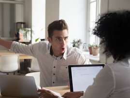 Arguing at office stock image