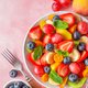 Fresh fruit salad in a bowl with fork