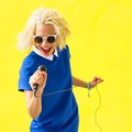 Woman singing with microphone stock photo