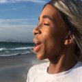 lasizwe dambuza on the beach