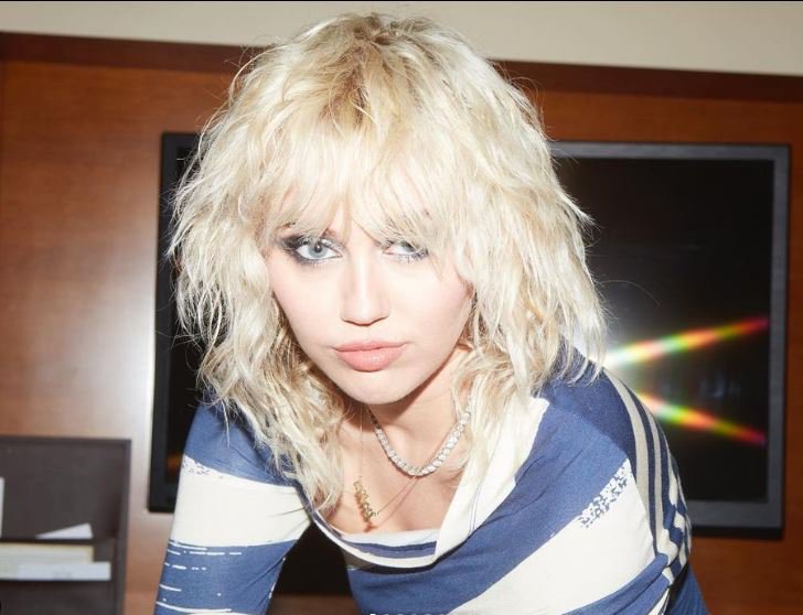 Miley Cyrus in blue and white top Instagram post