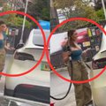 Hilarious moment woman attempts to fuel up Tesla car with petrol.