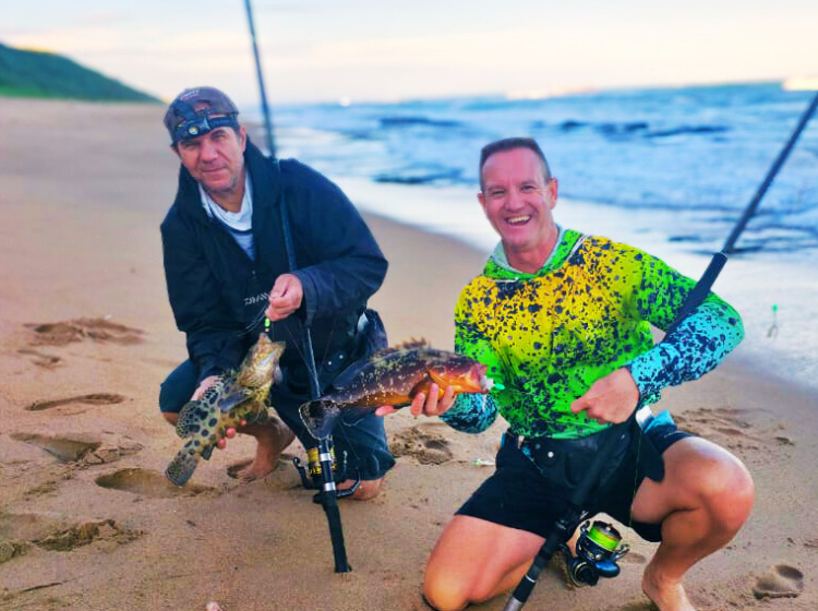 Rob Du Bussy and Ray Thompson with their rare catches—a Potato Bass and a Rockcod—both safely released after photography