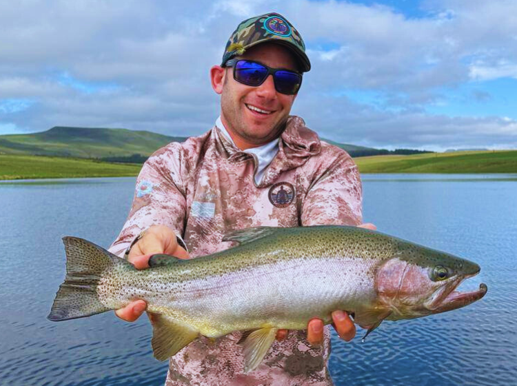 Daniel Factor with a rainbow trout caught during pre-nationals fishing