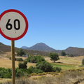 A 60 km per hour speed limit road sign