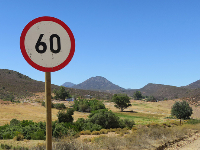 A 60 km per hour speed limit road sign