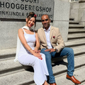 A bridal couple sit in front of the steps of the High Court in Cape Town