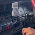 A calculator is housed inside a car phone holder