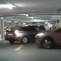 A car shoots up a ramp and slams into a walk inside an underground parking lot
