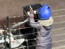 A delivery driver seen eating chips out of customer food order