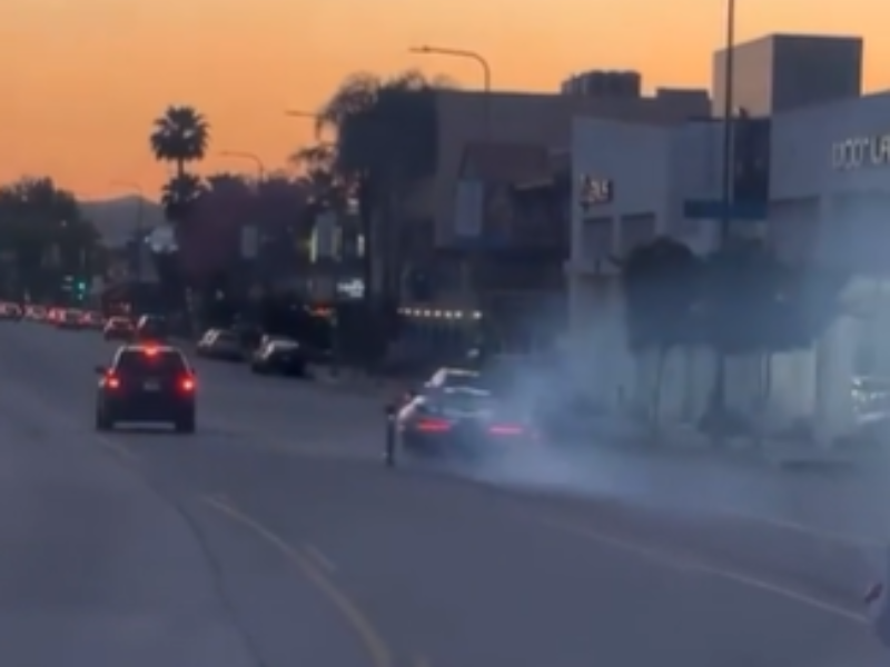 A driver doing donuts with a McLaren Senna on the streets of Los Angeles