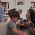 A father talking to his wife and three kids