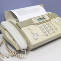 A fax machine for sending documents in the office