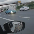 A green car drives in reverse on the N2 near Umgeni Road in Durban