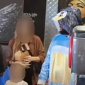 A man dressed up as Bluey at a restaurant