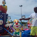 A man standing at the Chettys Fun Fair
