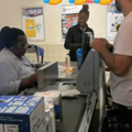 A man stands at the cashier inside a Pick n Pay store