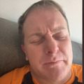 A man with his eyes closed praying
