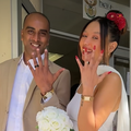 A married couple show off their rings in front of the Home Affairs office in Cape Town