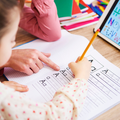 A mother helping her child with homework