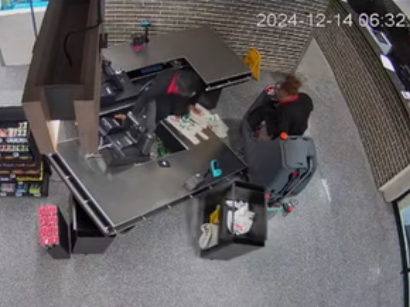 A person driving a floor cleaning machine crashes into a cashier till inside a SPAR