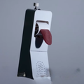 A phone receiver with a silicone tongue attachment on it