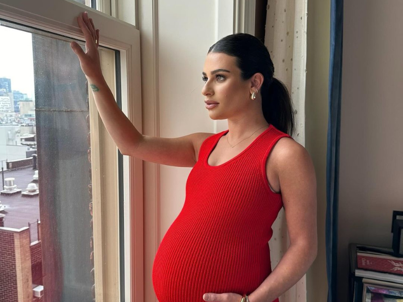 Pregnant Lea Michele wearing a red dress
