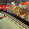 A shopping cart travelling down a cart escalator at a mall in Switzerland