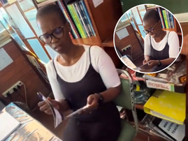A teacher looking at a picture of herself from her younger days