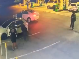 A vehicle is being hijacked at a petrol station in Chatsworth