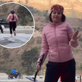 A woman dancing for a reel does not notice her baby walking to the roadway