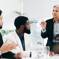 A woman leads a presentation in a meeting