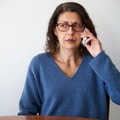 A woman on a phone call that looks scared