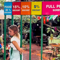 A woman tries passing through gated bars to earn a discount at restaurant