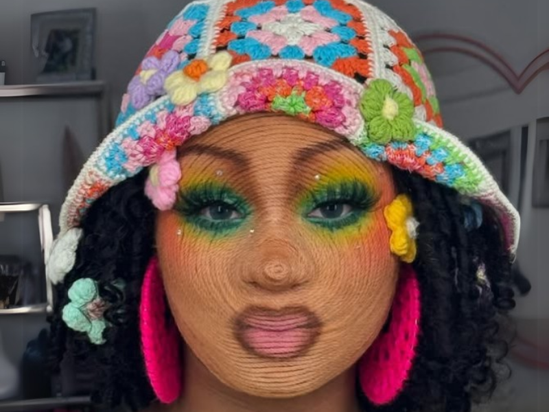 A woman with yarn stuck to her face