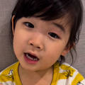 A young Asian girl wearing her pajamas