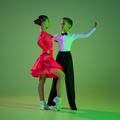 A young girl and boy dance to the rumba tango