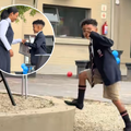 A young school boy tells his mother to lower her voice