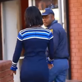 A young woman approaches a South African Police officer