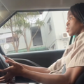 A young woman driving her car