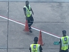 Airport staff playing with traffic cones on the airfield