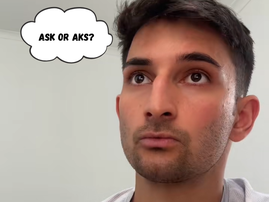 An Indian male looking shocked