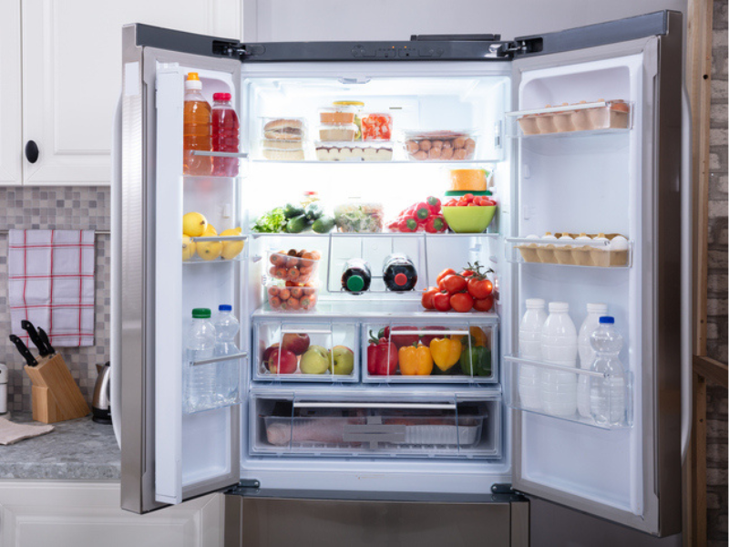 An open refrigerator with food inside
