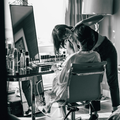 Bride getting her makeup done at home
