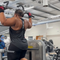 Carol Ofori doing pull up exercises at the gym