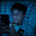 CHILD_ON_PHONE_IN_DARK